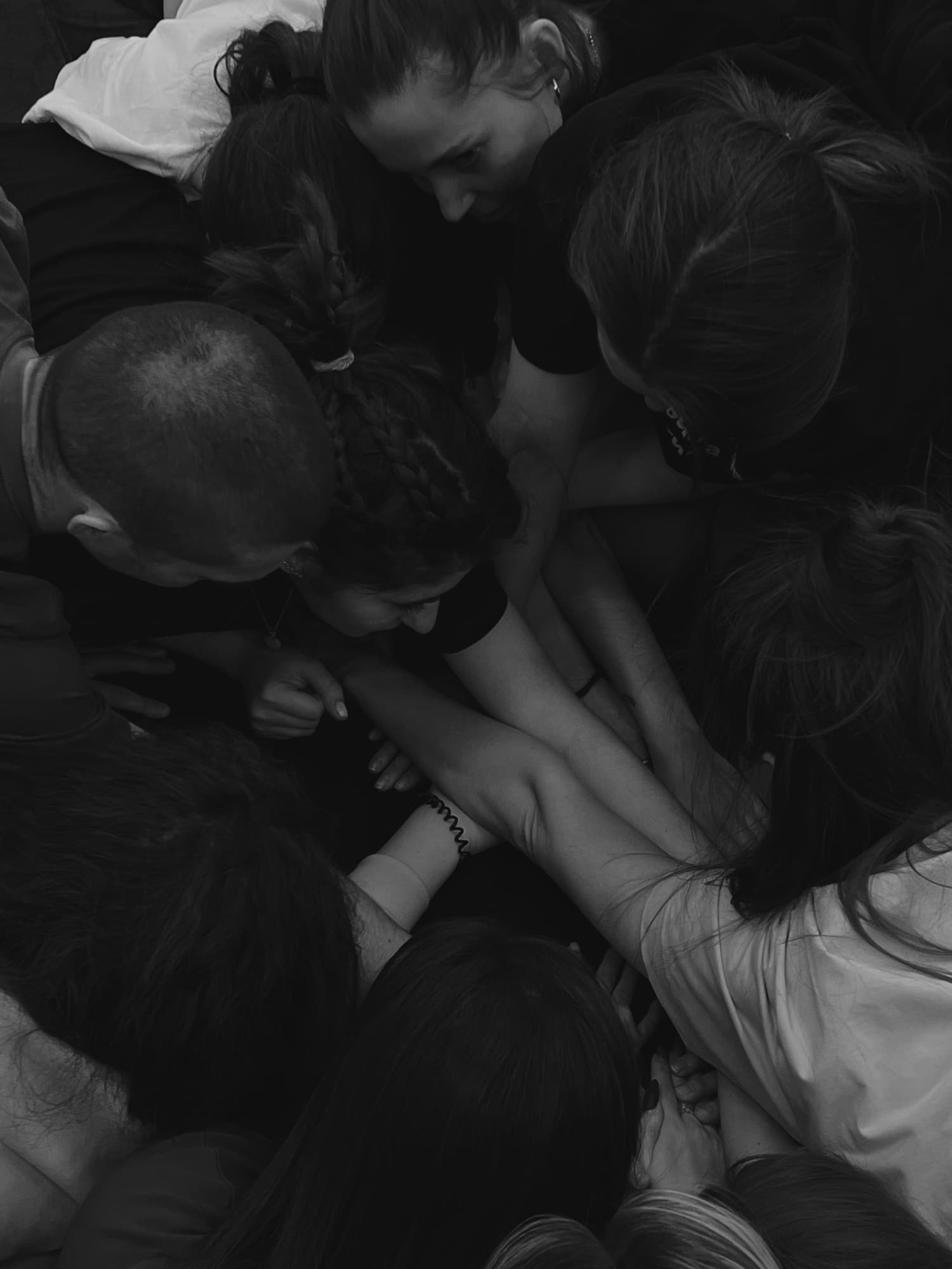 Workshop participants gathered closely around shared touch and contact.
