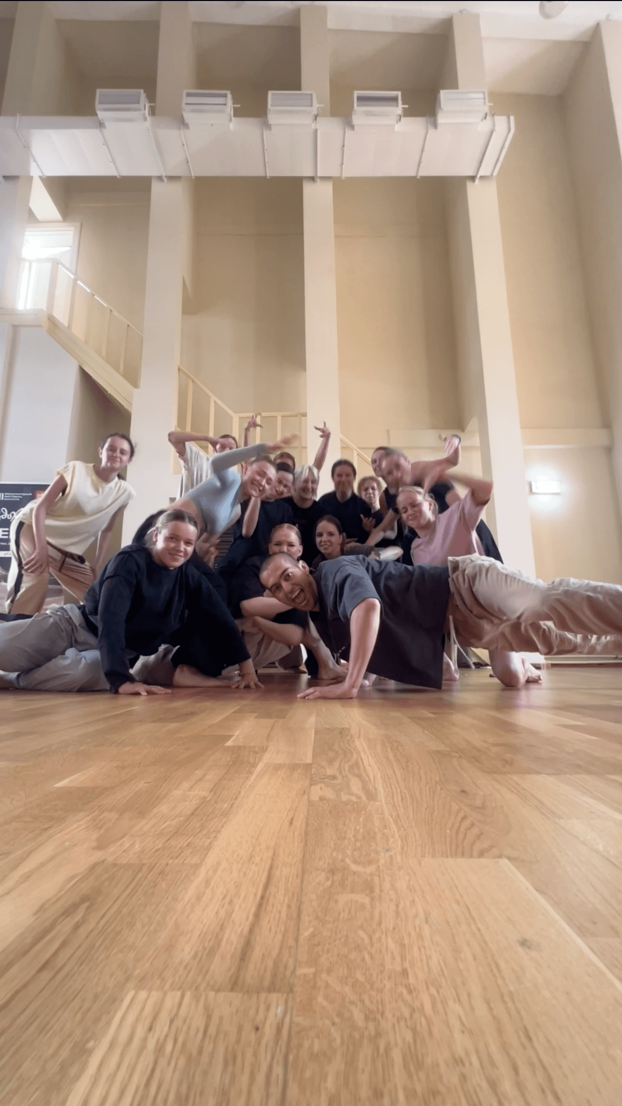 The Green Theatre laboratory ensemble gathers for a playful group portrait in the studio.