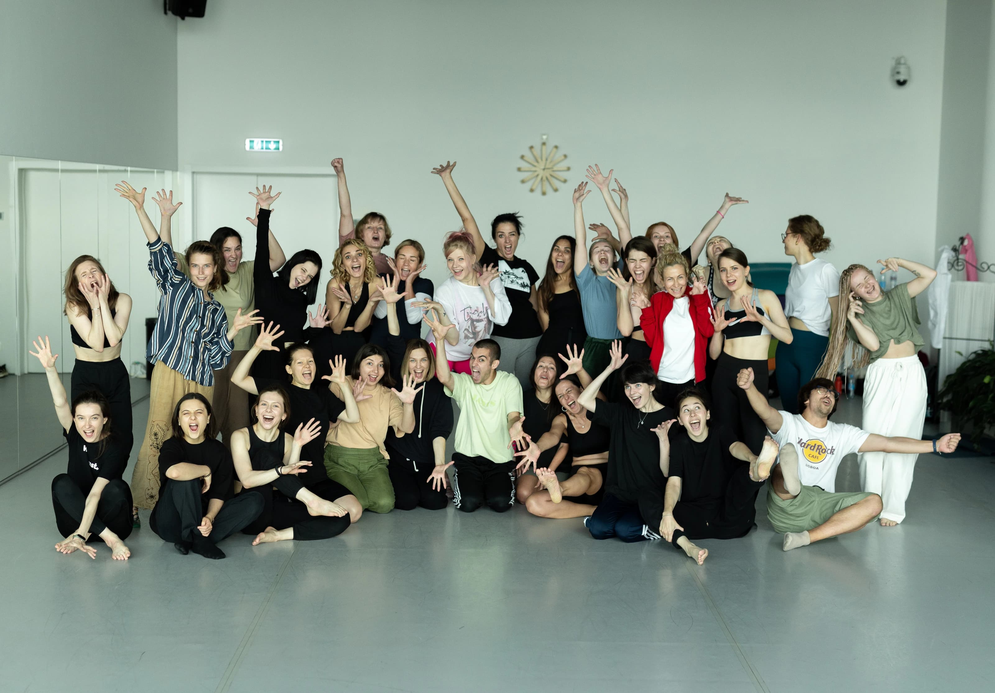 Workshop participants gather for an expressive group portrait.
