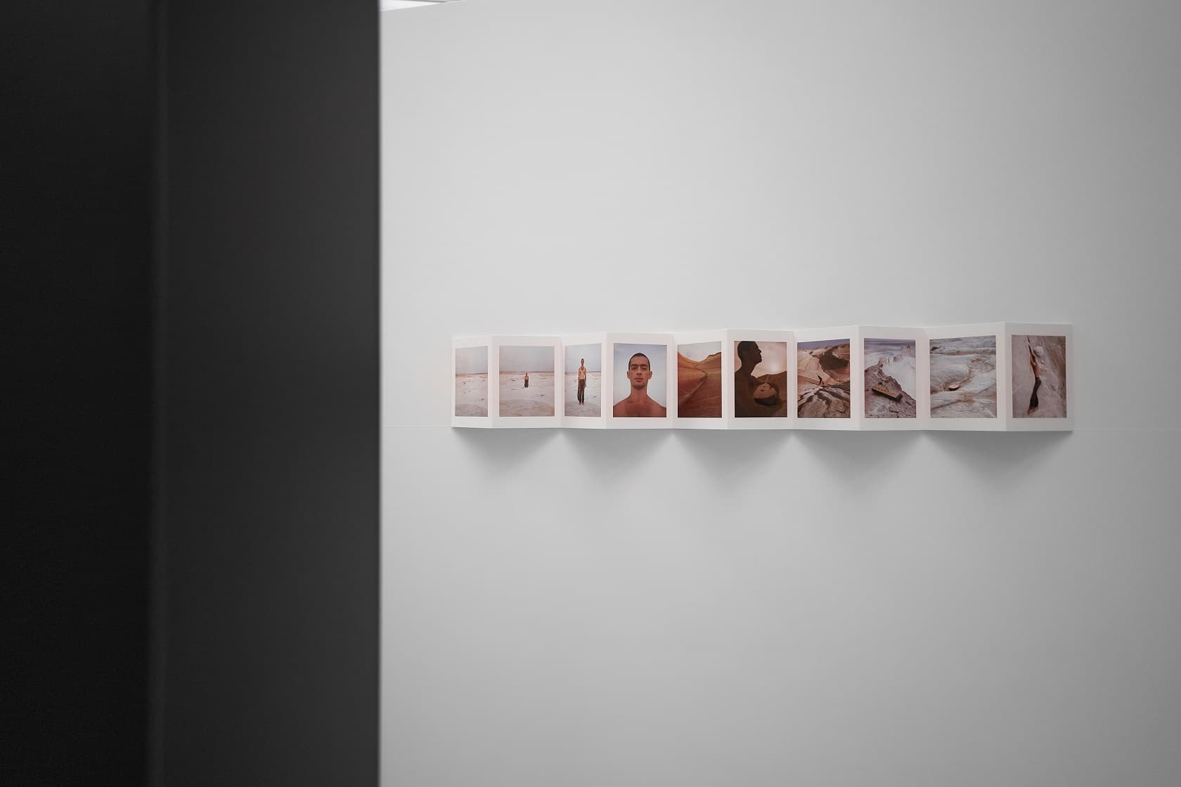 A sequence of ten Rhythm of the Steppe photographs mounted on a white gallery wall.